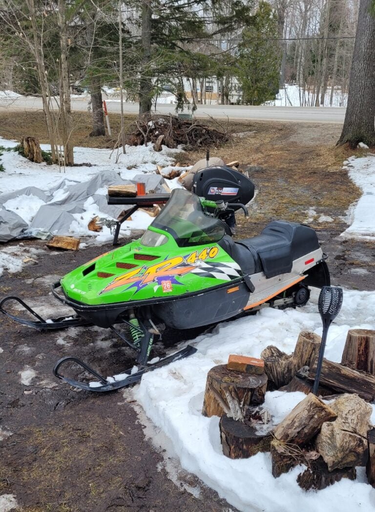 Trusty log splitter muscles wood before the coming storm